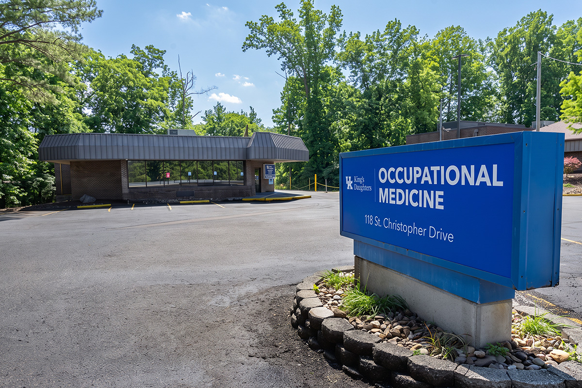 Building with a sign in the foreground for UK King's Daughters Occupational Medicine