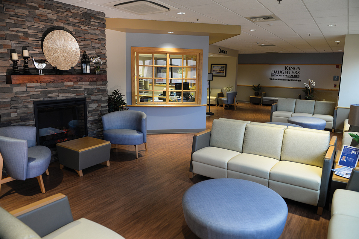 Interior of oncology center waiting area with chairs and furniture.