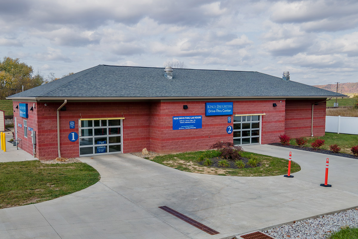 Exterior of building with two garage bay doors