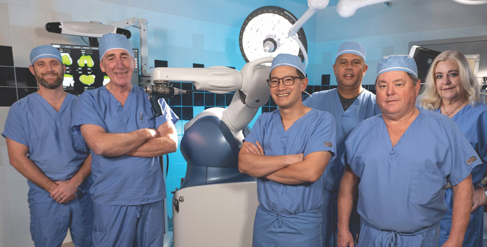 Orthopedic surgeons Brock Johnson, M.D., George Aitken, M.D., Felix Cheung, M.D., Gerry Trinidad, M.D., Steven Carawan, M.D., and Laura Reese, D.O., with the Mako Total Knee System.
