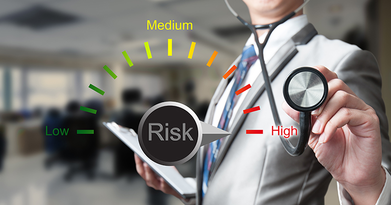 Medical professional holding a stethoscope with a risk meter graphic set to high risk