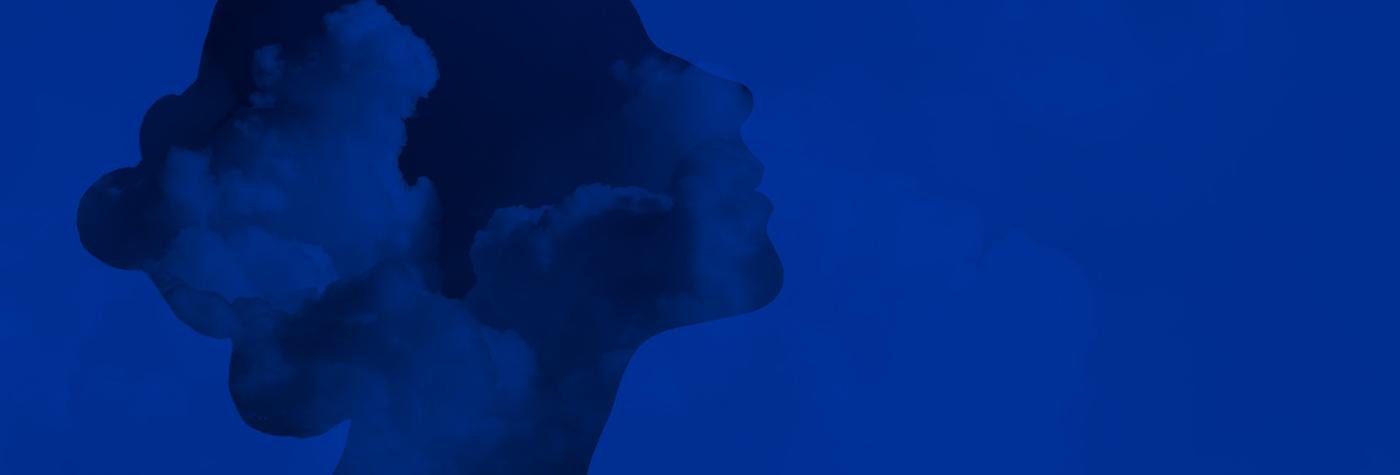 Silhouette of a woman's head with clouds