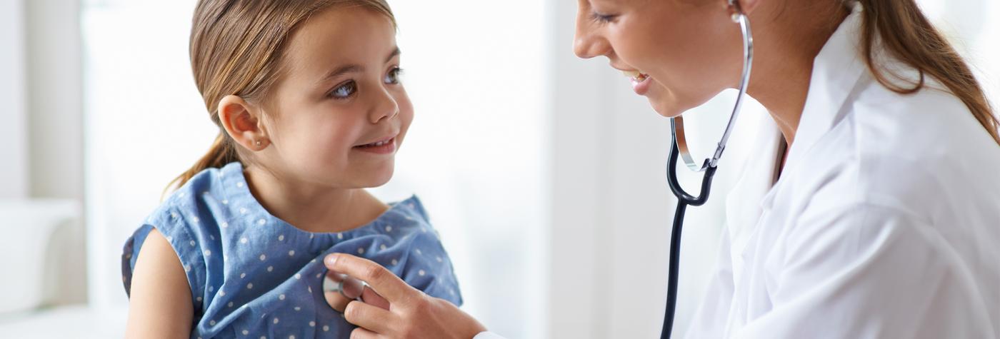Pediatric provider listens to child's heart