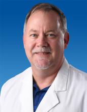 Man in a white lab coat