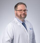 Man wearing white physician coat